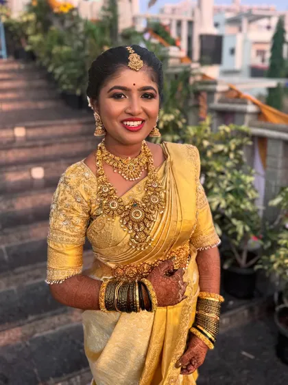 This outdoor, natural light photo demonstrates how the makeup translates from indoor to outdoor settings. The look remains flawless and radiant, a crucial skill for any professional MUA.