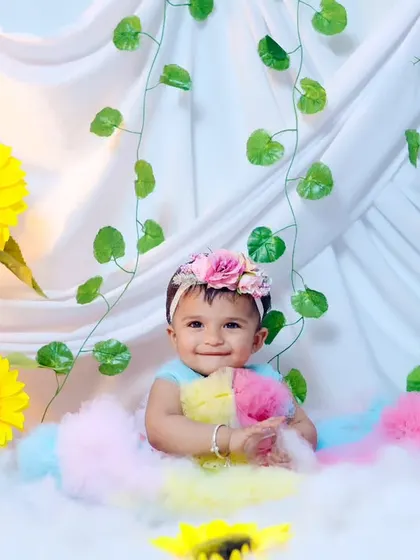 A happy, smiling portrait from the sunflower and clouds session.