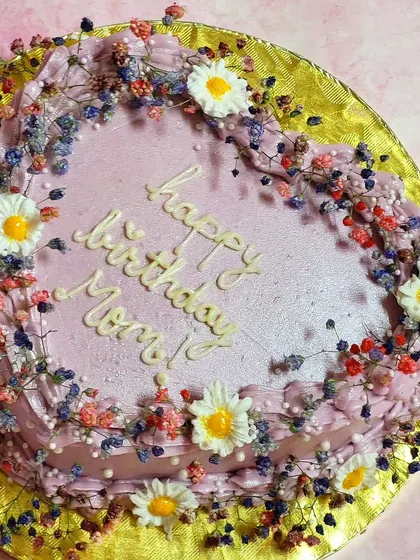 I'm a sucker for Gypsophilia on cakes. This heart-shaped cake is bordered with colorful baby's breath, creating a beautiful, rustic look for a mom's birthday.
