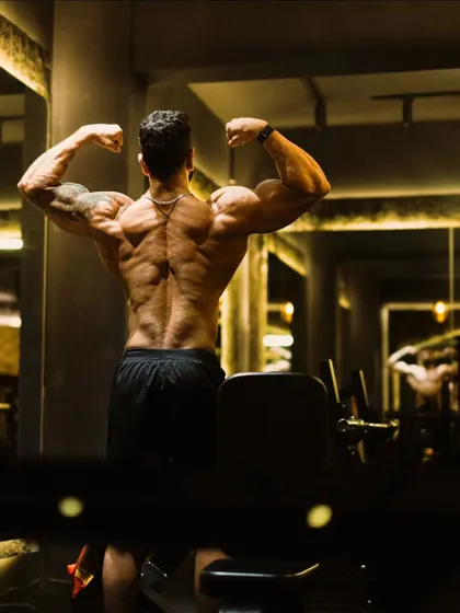 A final look at the rear double bicep pose, a classic display of power and symmetry.