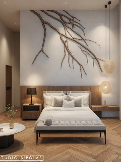 In this bedroom for a holiday home in Kangra, we embraced warm minimalism. A custom-designed sculptural branch art piece made of wood is set against a clean marble wall, creating a serene focal point that brings the beauty of nature indoors.