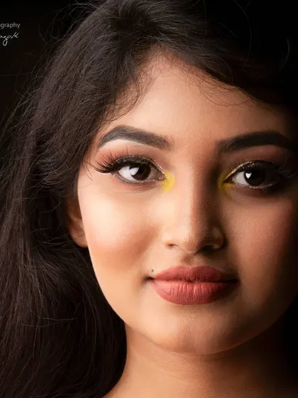 A warm, inviting portrait of Rachana Inder. The soft lighting and her gentle smile create a very approachable and friendly mood.