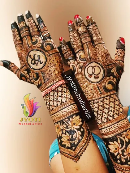 It's all in the details. This full bridal design incorporates the couple's initials and engagement rings, making the mehndi truly personal. I combine these custom elements with traditional patterns and lotus motifs for a complete and meaningful look.