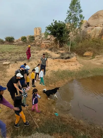 Even the doggo enjoys a splash in a puddle during our community trek, reminding us of the simple joys of being outdoors.