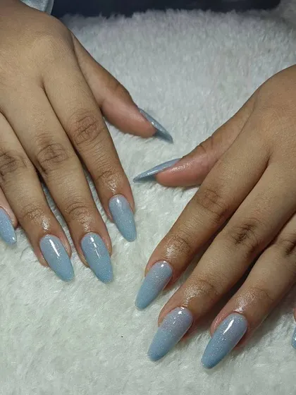 These long, stiletto extensions in a shimmering powder blue are so dreamy. A simple color can make a huge statement with the right shape.