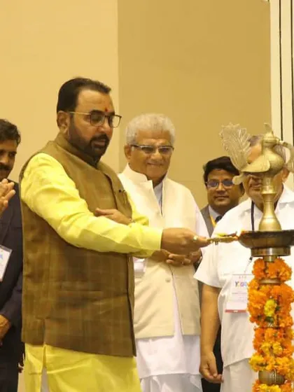 Participating in the ceremonial lamp lighting at the Yoga Mahotsav. These traditions mark the auspicious beginning of an event dedicated to wellness and peace.