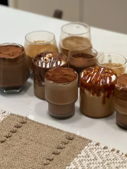 Another angle of the delicious results from a coffee workshop. Each glass holds a different creation, ready to be enjoyed. It’s a feast for the eyes and the palate.