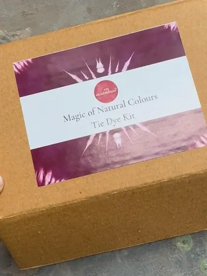 A close-up of the 'Magic of Natural Colours' tie-dye kit box. The design reflects the beautiful, natural patterns you can create.