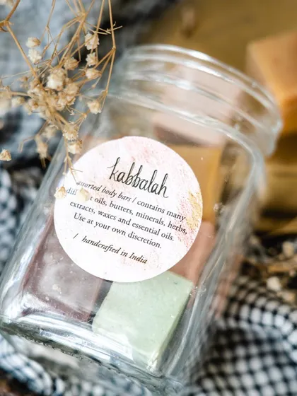 A close-up of the label on my assorted body bars jar. I believe in transparency, so I always note that my products contain natural oils, butters, herbs, and extracts.