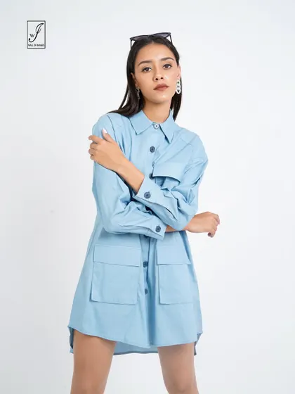 A front-facing shot that clearly displays the pocket details and button-down front of the shirt dress.