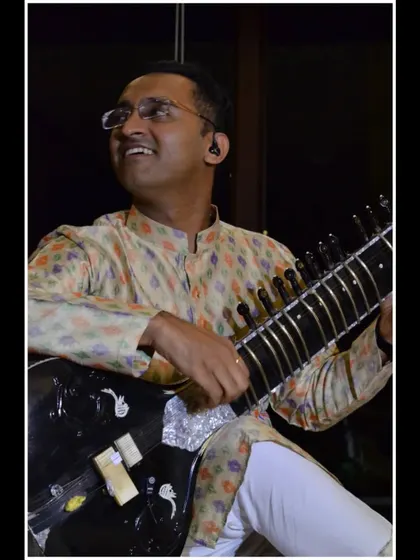 A moment of joy while playing for a small, appreciative audience. The connection in a 'Baithak' is truly special.