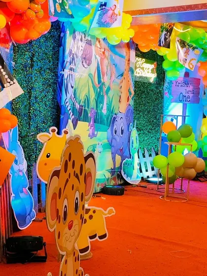 A close-up of the animal cutouts and photo displays at the jungle party.