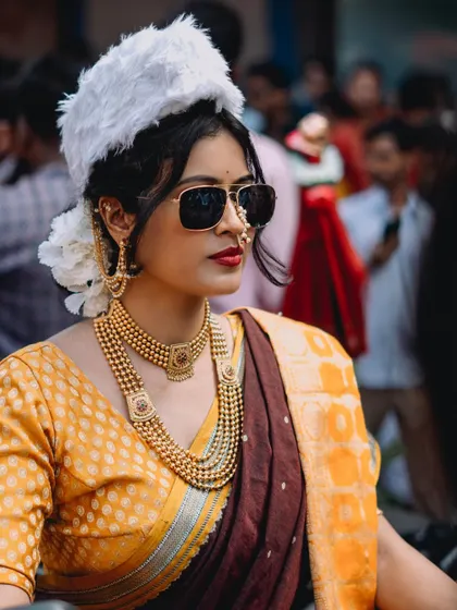 A collection of portraits from the Gudi Padwa parade in Girgaon. The series showcases women in stunning traditional attire, playing dhols and riding motorcycles, blending tradition with modernity.