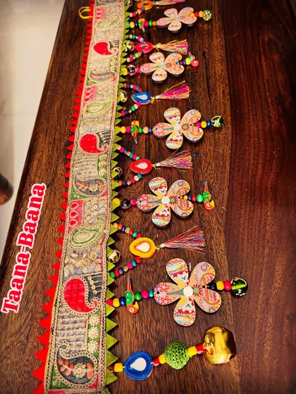 The 'Taana Baana' toran laid out to show its full 48-inch glory. The combination of chaotic beauty and conscious, eco-friendly materials makes this piece truly special.
