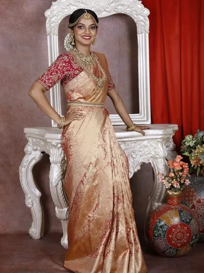 This full-length view shows the grandeur of the traditional bridal saree, perfect for your big day.