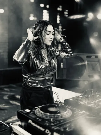 A black and white photo capturing an intimate moment of me listening through my headphones, preparing the next song.