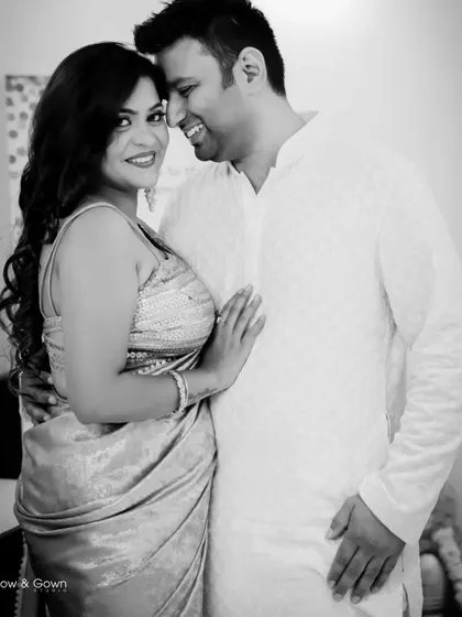 A sweet and happy black and white portrait from a Roka ceremony. The couple's close embrace and genuine smiles make this a heartwarming photo.