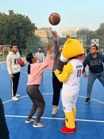 Even our mascot gets in on the action, contesting a jump ball during the parents' match. We are all about creating a fun and engaging environment.