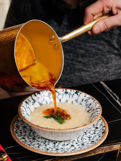 A taste of Turkey. A rich, traditional soup is poured tableside, adding a touch of ceremony to your dining experience.