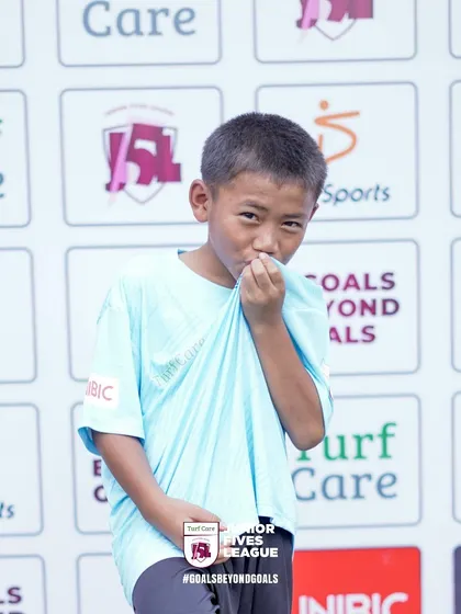 A young participant's playful celebration pose. My youth leagues are designed to be fun and to let the unique personalities of the players shine.
