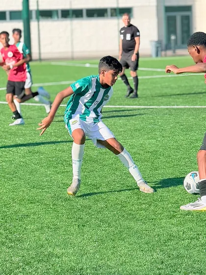 A player from our U-13 team engages in a challenge during their London tour, embracing the opportunity to compete abroad.
