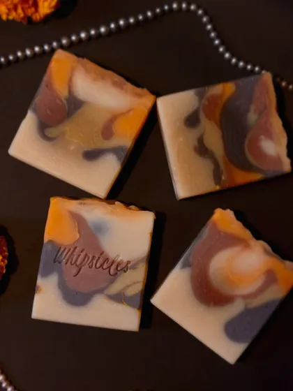 The beautiful, artistic swirls of our Noor Santhal soap. Each bar is unique, colored with Rose clay and Fullers earth for a truly artisanal touch.