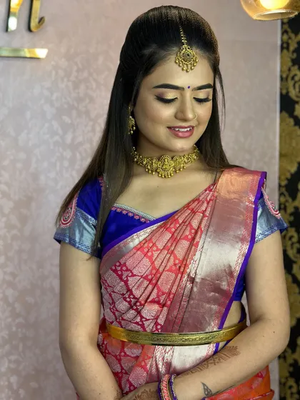 More examples of clean and elegant hairstyles and draping for pre-wedding functions, ensuring the bride looks polished and ready for photos.