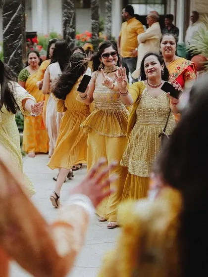 A duplicate of the bride's family dancing, showing the energy and excitement of the event.