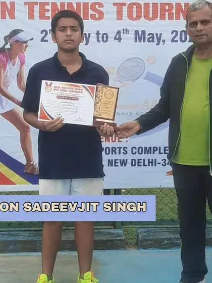 Champion Sadeevjit Singh receiving his trophy at the Delhi/NCR Inter-School Open Tennis Tournament. His victory is a result of consistent hard work and focused coaching.
