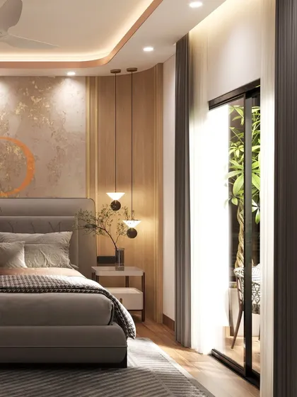 A close-up of the bed and side table, showing the warm wood tones, pendant lighting, and textured gold-leaf accent wall.