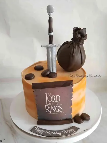 This cake is based on the famous series, Lord of the Rings. I handcrafted the sword and other iconic elements for Abhay's birthday.