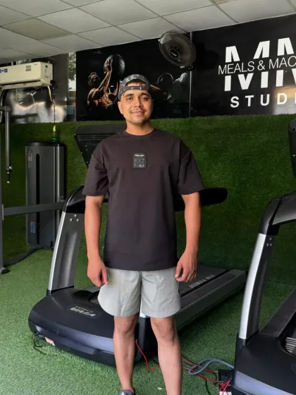 Standing by the treadmills.