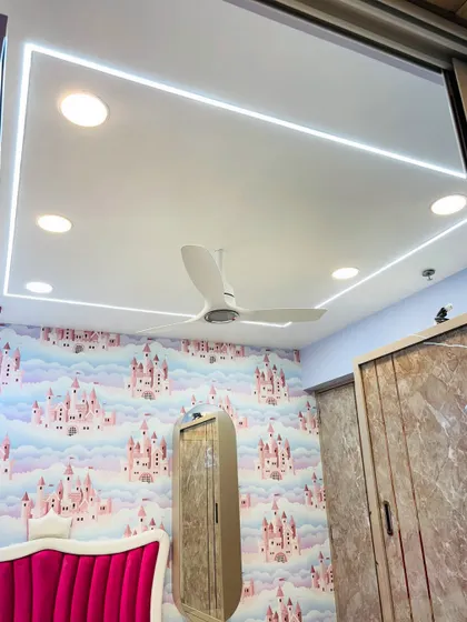 The false ceiling in this child's bedroom features clean LED strip lighting, providing bright, even illumination that complements the whimsical castle-themed wallpaper.