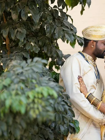 A beautiful moment between the bride and groom. My goal is to create a look that makes the bride feel confident and radiant, allowing her natural happiness to shine through.