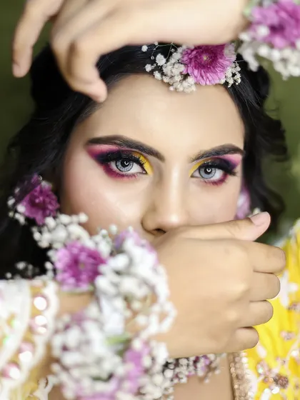 This creative shot for a Haldi look shows the playful and artistic side of makeup. Our portfolio sessions help students build a diverse and impressive body of work.