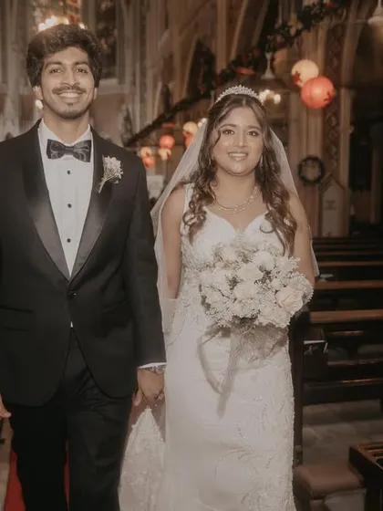 The newly married couple walking down the aisle of the church. This classic shot captures their first moments as husband and wife, filled with joy and hope.