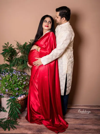 Another pose from the same traditional studio shoot, showing the couple's connection and shared joy.