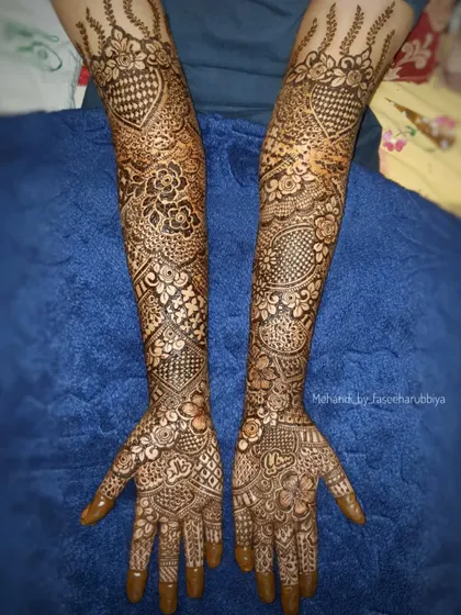 A top-down view of the full bridal design, showing the symmetry and complexity of the patterns.
