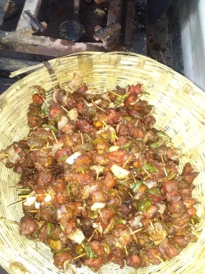 A basket full of freshly prepared chicken stick kebabs. These bite-sized starters are easy for guests to enjoy and are a popular item on my menu.