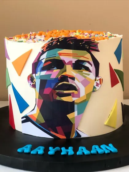 A colorful pop-art style Cristiano Ronaldo cake.