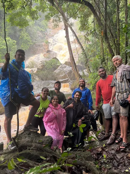 A group photo with our local guide, who helps us navigate these hidden trails safely. Their knowledge of the forest is invaluable.