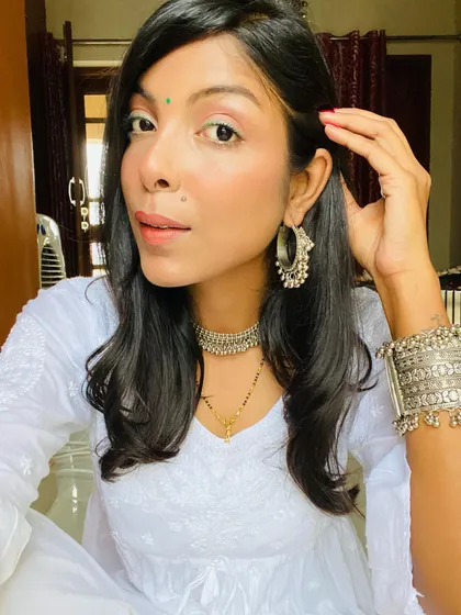 A close-up of the oxidized silver jewelry, including the choker and bangles, that I paired with my all-white ethnic outfit. Accessories can completely define the vibe of a simple look.