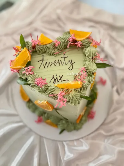 Another angle of the unique heart-shaped cake, perfect for a modern celebration.
