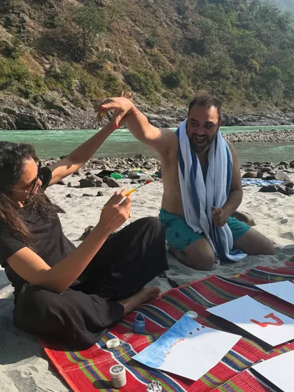 An art therapy session on the banks of the Ganga. Using watercolors to capture the flow of the river and our own creativity is a beautiful way to connect with the water element.