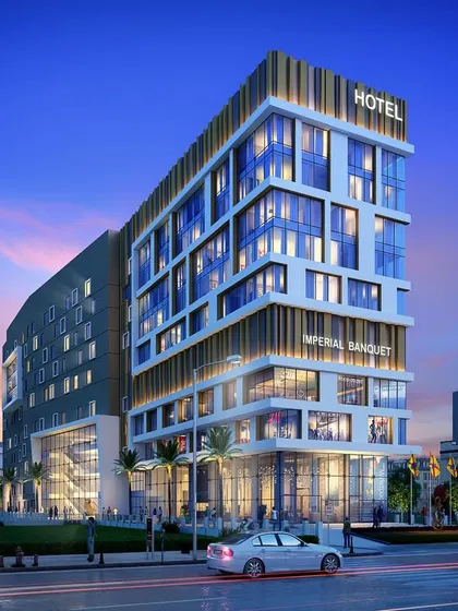 A street-level view of the same hotel project, highlighting its contemporary facade with varied materials and forms.