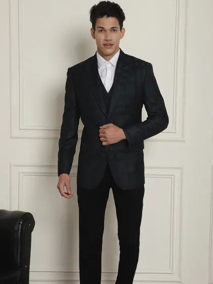 The full look of our dark checkered three-piece suit, a sophisticated choice for any formal occasion.