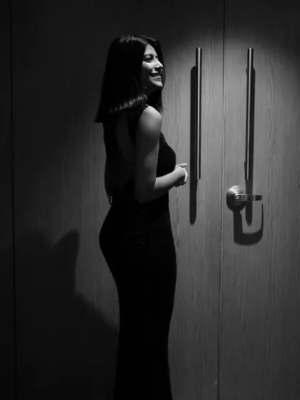 A black and white shot post-event. Even after a long day, it's about feeling confident and accomplished.