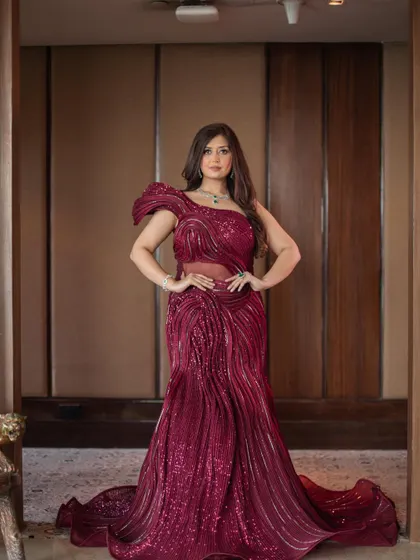 Another powerful portrait in the red sculpted gown. This dress is all about celebrating the female form with its artistic and figure-flattering design.