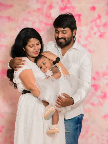 The full family together. This studio portrait captures the family in a warm embrace, creating a cherished memory of their love and togetherness.