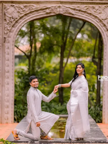 A classic proposal pose with a traditional twist. The couple, dressed in beautiful white and silver ethnic wear, creates a timeless and elegant pre-wedding portrait.